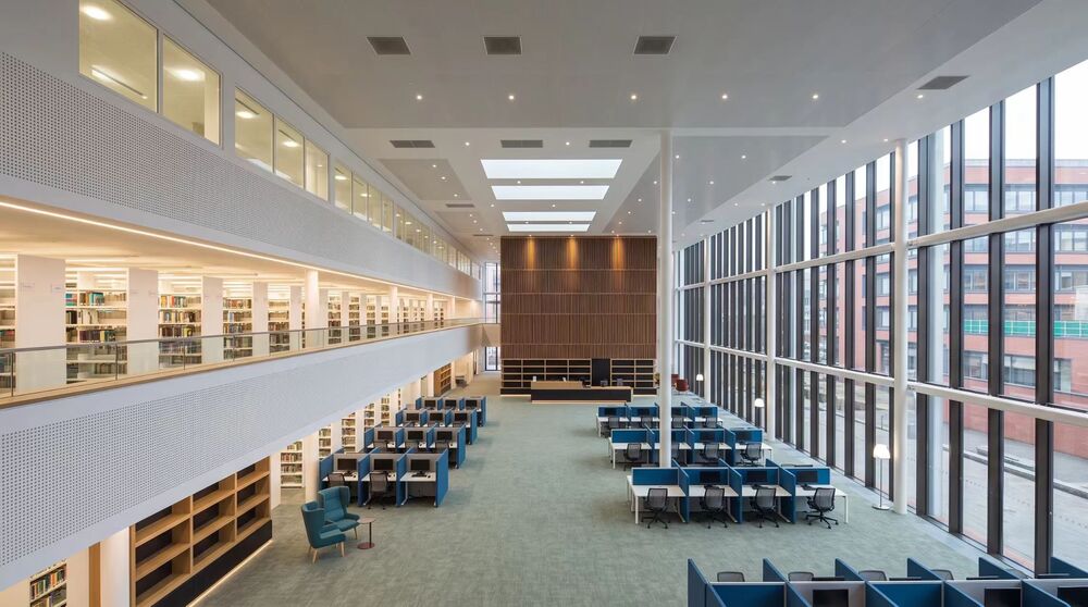 Library and reading room - double-height study floor with mezzanine stacks
