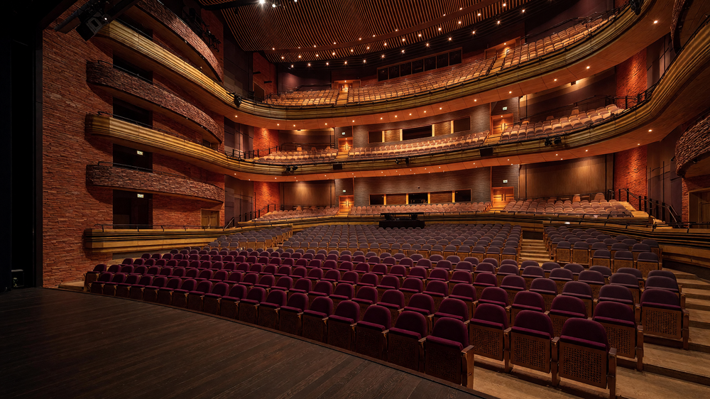 Main auditorium - timber ceiling, curved balcony fronts and stalls seating