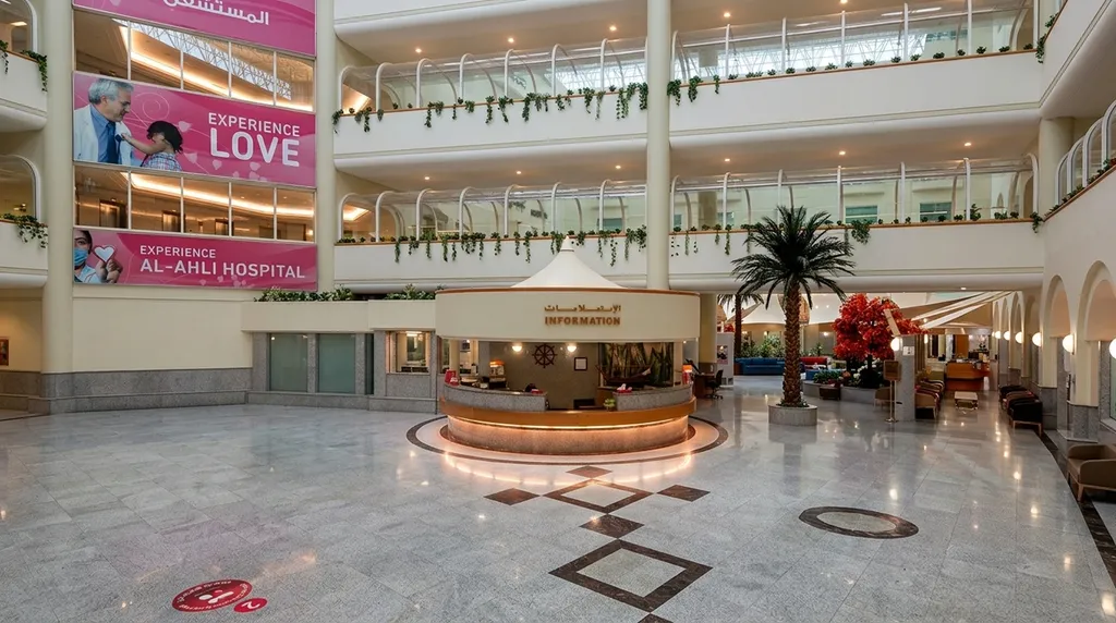 Al-Ahli Hospital main atrium - information desk, balcony handrail lighting across three levels